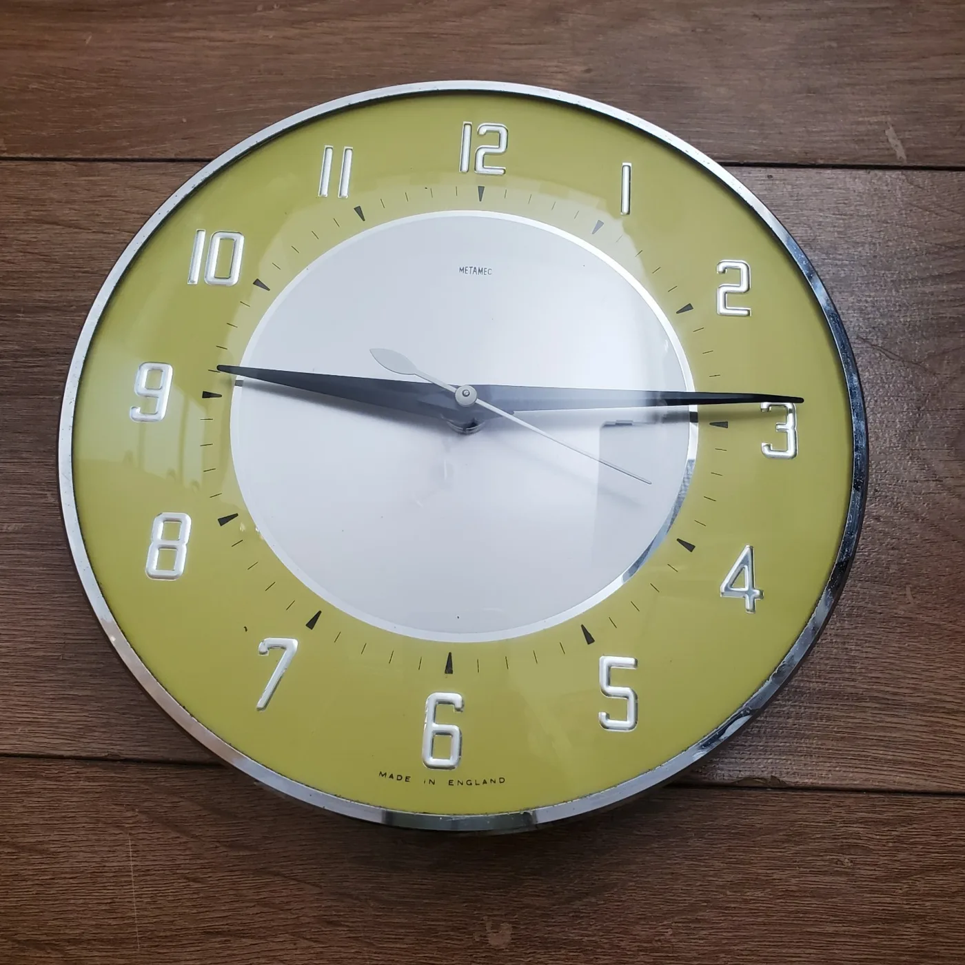 Front view of the Metamec clock, showing the original dial and hands